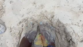 Temptress Mango sticks her toes in Bahamas beach sand