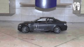 Black RC Car vs white Mules floor view