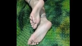 rubbing feet against blanket