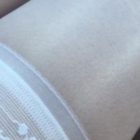 Teasing wearing layered shiny pantyhose and white nylons