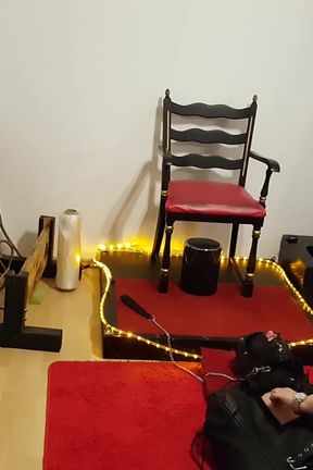 Curvy Brunette Dominatrix Commands Bound Slave in Fetish Dungeon