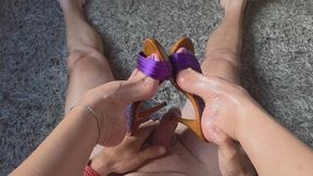 Milah enjoying a footjob with her slave while wearing her violet Kiara heels