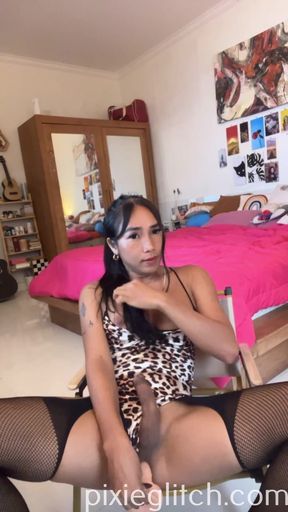 Asian Transgirl is fucking herself with a dildo and cumming