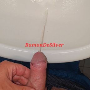 Master Ramon goes to piss in the sink in his sexy shorts, hot