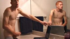 In this solo scene, young Tristian beats off in the bathroom to porn on a laptop, releasing all over mirror and counter top.