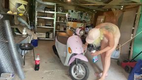 Hairy girl - motorbike cleaning