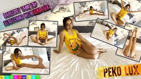 Barefoot Tank Top Peko Stretching on a Bed - MP4 (SD)