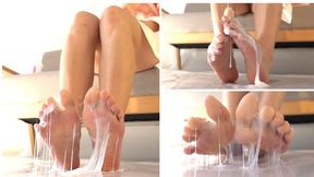 Girl's tender feet are covered with sticky liquid