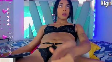 Her Huge Dick Is Tugged On Webcam By A Sexy Latina Shemale With Tattoos