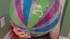 Empress Scarlett blows up a beach ball and try’s to pop it (no pop)