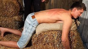 Boy back flogging in the barn