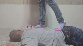 Chrissy tramples Dan in colorful socks