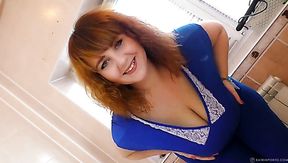 A red-haired BBW milf danced a striptease for a neighbor who was watching her through the window