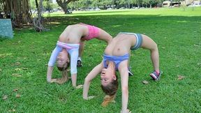 Young athletic girls tease each other and play in the sun