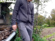 Russian guy smokes a cigarette in dirty shoes and spits