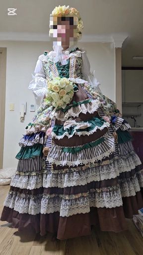 A crossdressing man is wearing a dress and dancing.