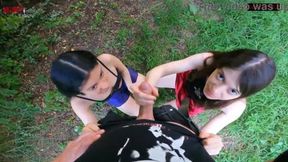 Skinny brunette gets double handjob from big cock in public