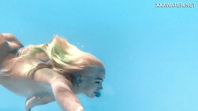 Busty pornstar Lisi sunbathes nude by the pool