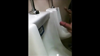 two slim dicks getting wanked at the urinals 10