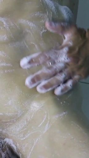 a very sexy guy washes in the shower after a workout and jerks off his rich cock   Clip 1