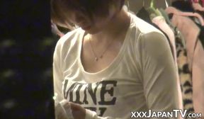 Sweet Asian rubs her furry pussy in bed before fingerbanging herself