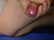 Hard uncircumcised micropenis lotioned up and beeing jerked with thick strands of cum
