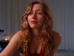 Amateur redhead Jacqueline with glasses masturbates
