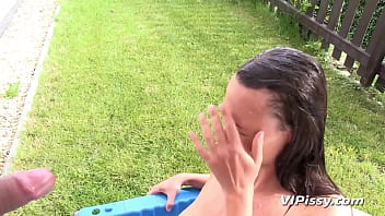 Girl bathes and fucks in piss under the sun