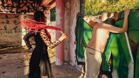 BDSM femdom flogging. Dominatrix Nika punishes her slave at sunset in an abandoned building. Back scratching.