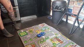 MissaRaeBerry toy car crush she crushes 2 old cars ford and Toyota MR2 in high heeled boots high left view