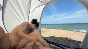 My Asian GF sits on a public beach, jerking my member while I'm naked.