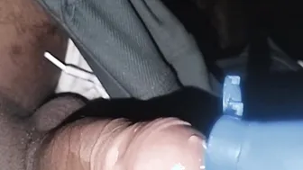 Indian twink oils up and strokes his big black cock in bathroom
