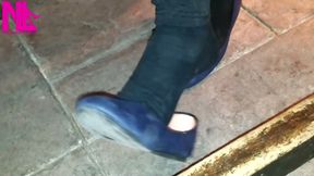 Dangling in Blue Ballet Flats in a Bar
