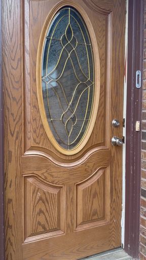 Wooden door with glass panel