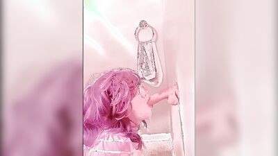 Pinky haired femboy sucks gummy dildo in this homemade video