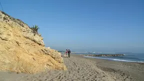 Carol Vega enjoys some intimate seaside fun during a hot sunset