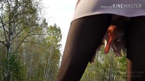 Walking in the park without panties in a mini dress and showing pussy