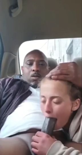 White amateur girl takes a BBC in public for an interracial blowjob scene