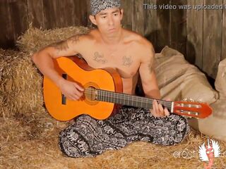 Homosexual oriental muscle guitarist plays with schlong on the hay
