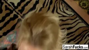 Blonde bombshell Sarah Jessie takes off her top to reveal her massive natural knockers