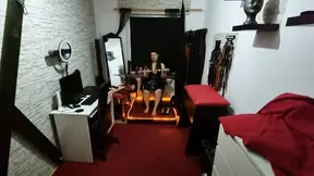 Mistress dominates slave with electric toys and spreader bar