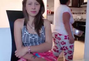Lewd cam slut is showing off her private parts with her neighbor in the room