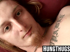 Inked thug grabs his throbbing dick for solo action