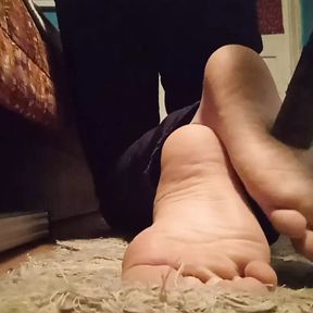 Twink vacuums his dirty soles