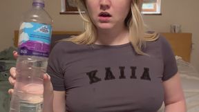 Chugging water, burping and showing bloated belly