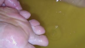 I'm soaking my bare feet in a bowl of water.