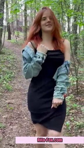 Sexy redheaded pussy walks through the woods almost naked