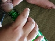 Small cock pissing into bottle - urination