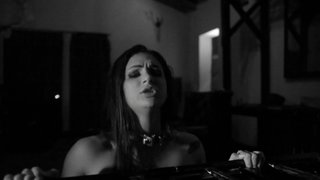 A busty chick is fucked in the black and white video today
