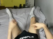 Boy in long white socks plays with his cock with a shot